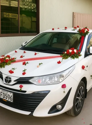Lahore Blooms red ribbon and roses wedding car décor front view
