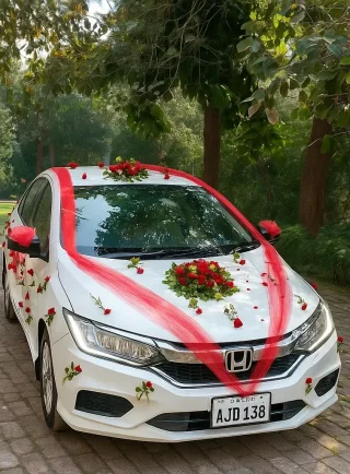 Lahore Blooms red ribbon and roses bridal car decoration