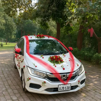 Lahore Blooms red ribbon and roses bridal car decoration