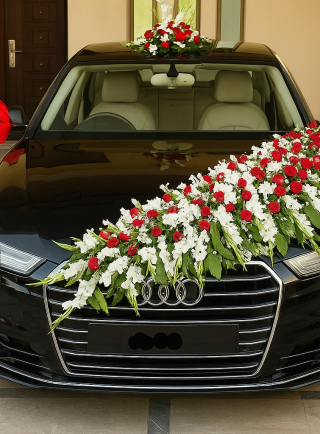 Lahore Blooms red and white garland bridal car décor on black Audi sedan