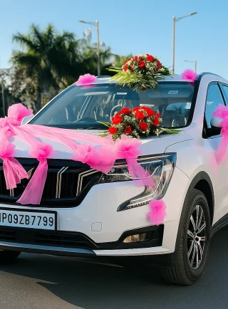 Lahore Blooms pink ribbon wedding car decoration on white SUV