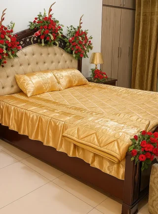 Elegant bridal room flower decoration with red roses and golden bedspread – Lahore Blooms