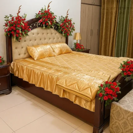 Elegant bridal room flower decoration with red roses and golden bedspread – Lahore Blooms