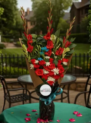 Tall standing bouquet with red gladiolus, red roses, white daisies and greenery in kraft wrapping – Lahore Blooms