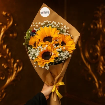 Sunflower bouquet with baby’s breath wrapped in kraft paper and yellow ribbon – Lahore Blooms