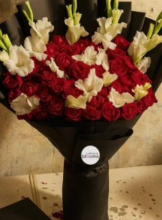 Grand red roses and white gladiolus bouquet wrapped in matte black paper – Lahore Blooms