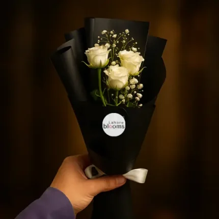 Mini bouquet of white roses with baby’s breath in matte black wrapping – Lahore Blooms