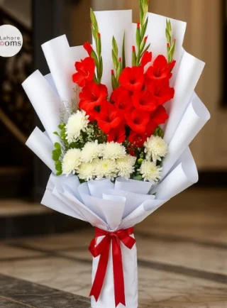 Tall red gladiolus and white chrysanthemum bouquet wrapped in white paper with red ribbon – Lahore Blooms