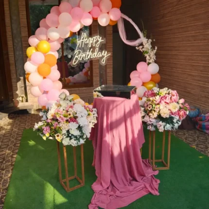 Birthday Balloon Ring Arch Setup – Fresh Flowers, Neon Sign & Draped Cake Table