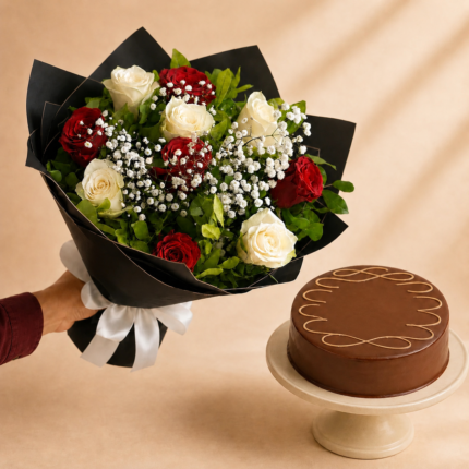 Velvet Classic flower and cake combo with red and white roses, baby’s breath, black wrapping and chocolate cake in Lahore.