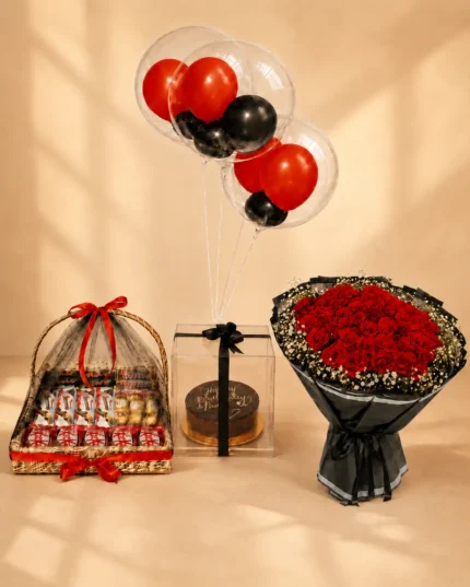 Luxury birthday surprise with large red rose bouquet, assorted chocolate basket, cake in acrylic box and red and black bubble balloons