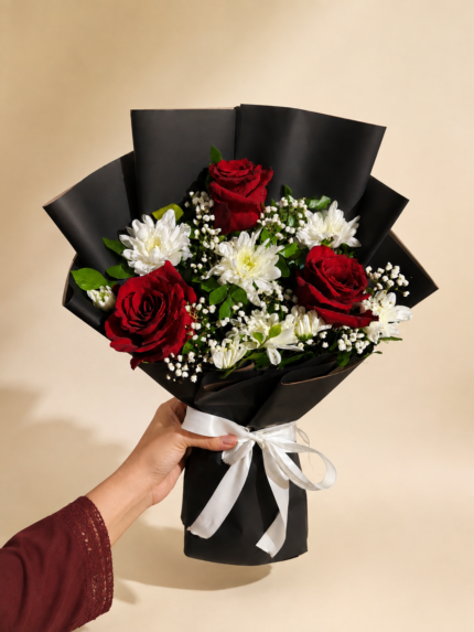 Red Empress red rose and white chrysanthemum bouquet with baby's breath in black wrap by Lahore Blooms