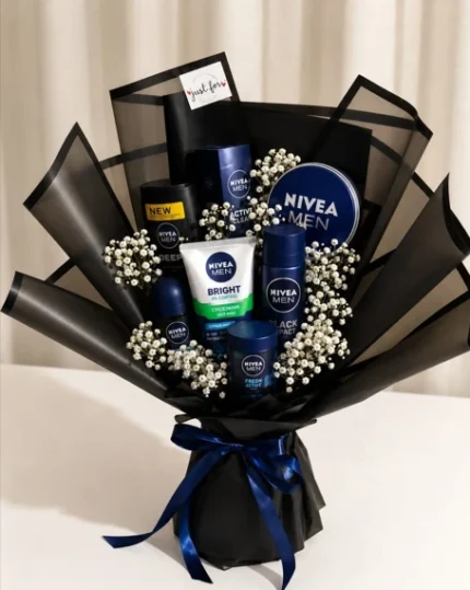 Black men's grooming gift bouquet with assorted Nivea Men skincare and deodorant products, baby's breath flowers and navy ribbon