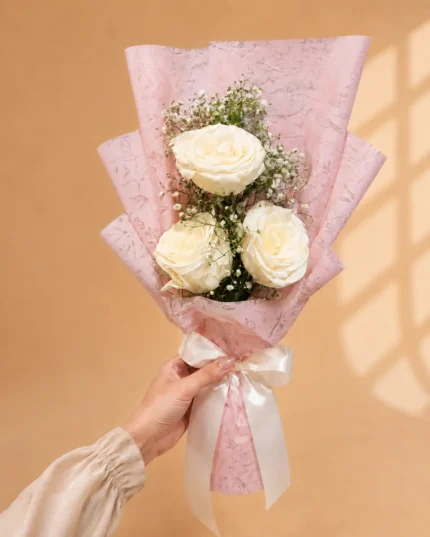 Blush Veil white rose bouquet with baby’s breath in blush pink wrapping in Lahore
