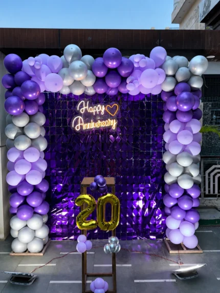 Purple and silver balloon birthday decoration with shimmer backdrop and customized age numbers in Lahore