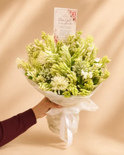 Fresh white tuberose arranged with delicate baby’s breath in an elegant white presentation. Naturally fragrant and beautifully full.