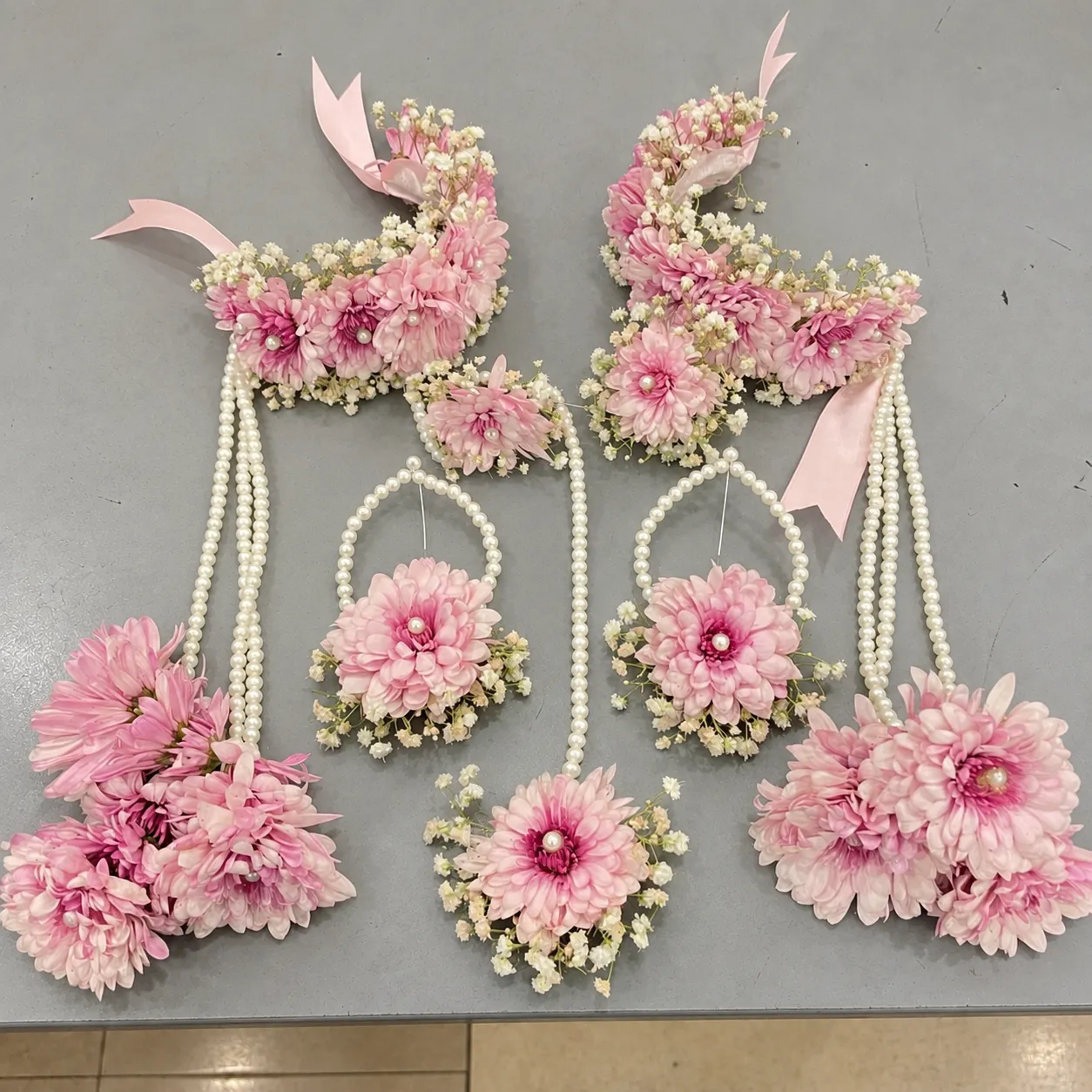 Blush Chrysanthemum Bridal Kalire Jewellery Set Blush pink chrysanthemum-style flowers, white filler flowers and pearl-style strands, wrist kalire with clustered floral drops.