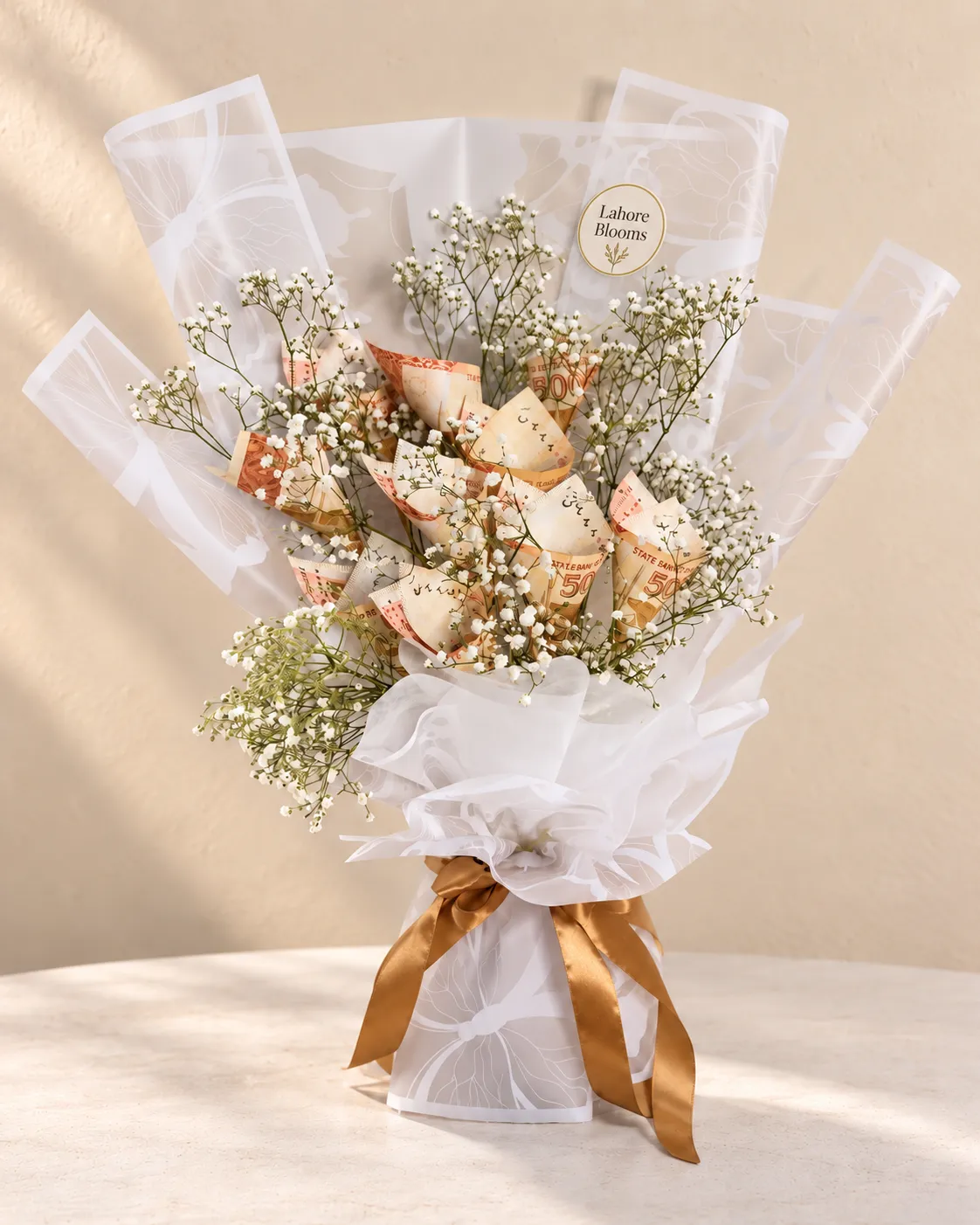 Ivory Rose Curled Money Bouquet Curled banknotes among ivory and peach roses with white filler flowers.