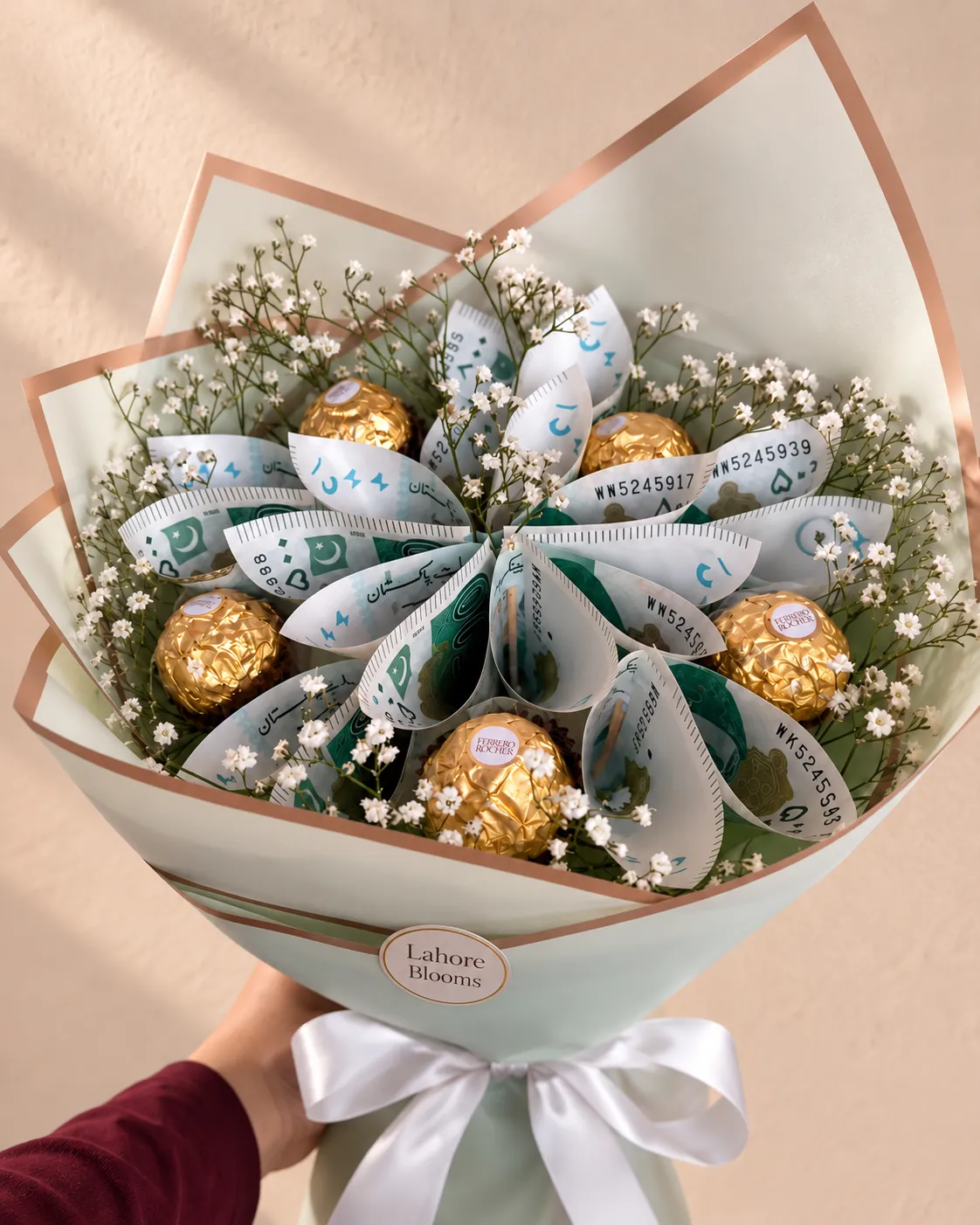 Pearl Fold Money and Chocolate Bouquet Petal-folded notes with pearl-like decorative accents and gold-wrapped chocolates in mint and peach wrapping.