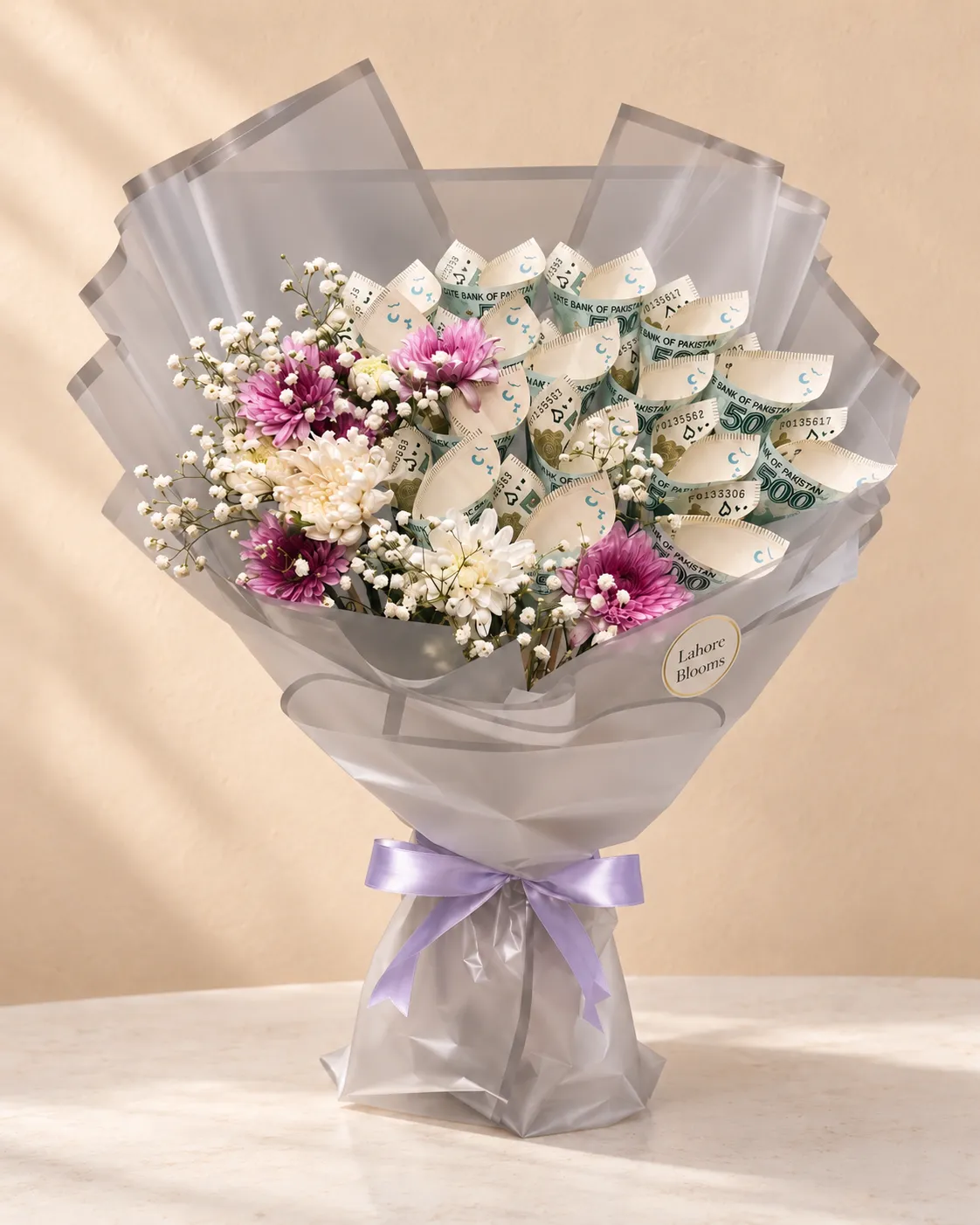 Purple Bloom Curled Money Bouquet Curled banknotes beside purple and white blooms in lavender-grey wrapping.