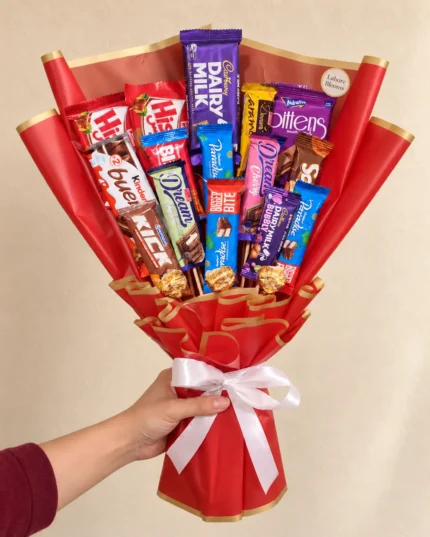An upright assortment of chocolate bars in red wrapping with a white bow.